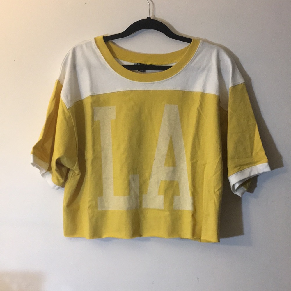 NWOT “LA” yellow Jersey style top